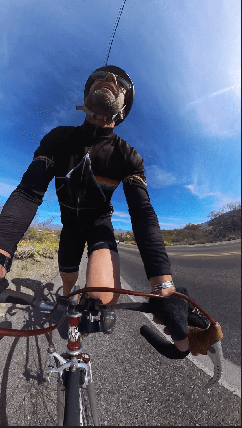 Michael Cavett riding a road bike outdoors